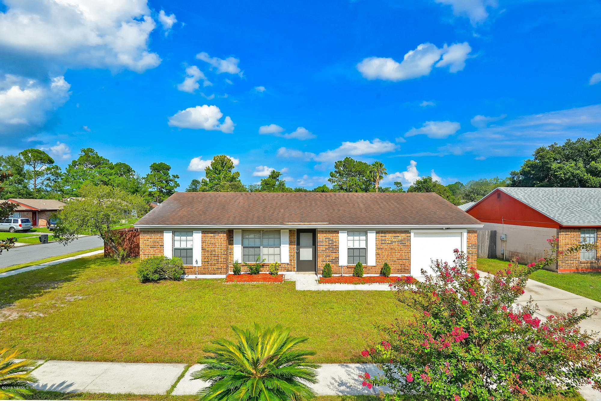 2545 Spring Lake Road West Jacksonville, FL 32210 - Photo 1 of 21 a house with swimming pool in front of it