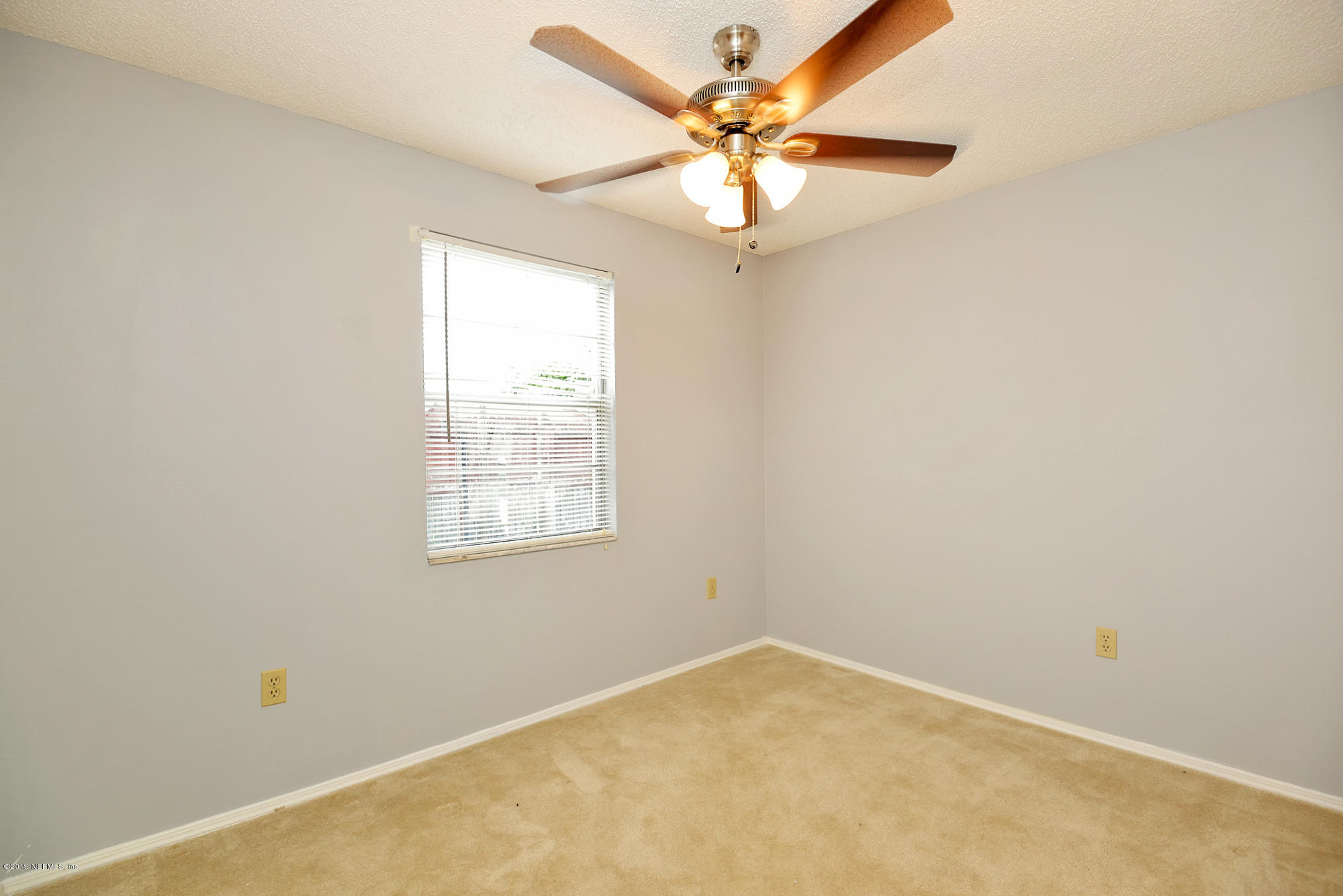 2545 Spring Lake Road West Jacksonville, FL 32210 - Photo 16 of 21 an empty room with a window