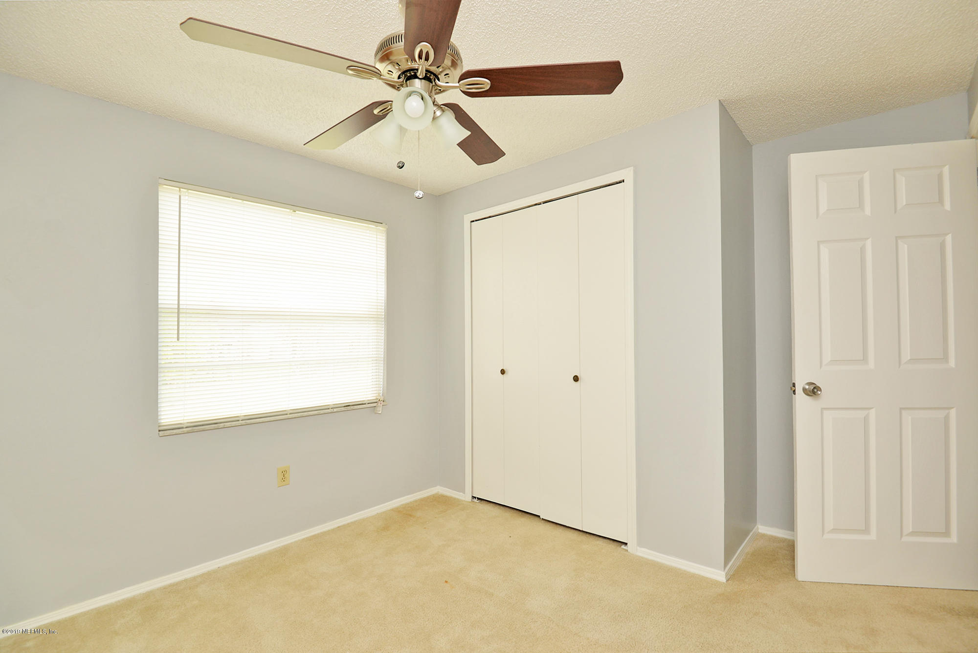 2545 Spring Lake Road West Jacksonville, FL 32210 - Photo 18 of 21 a view of an empty room with a window
