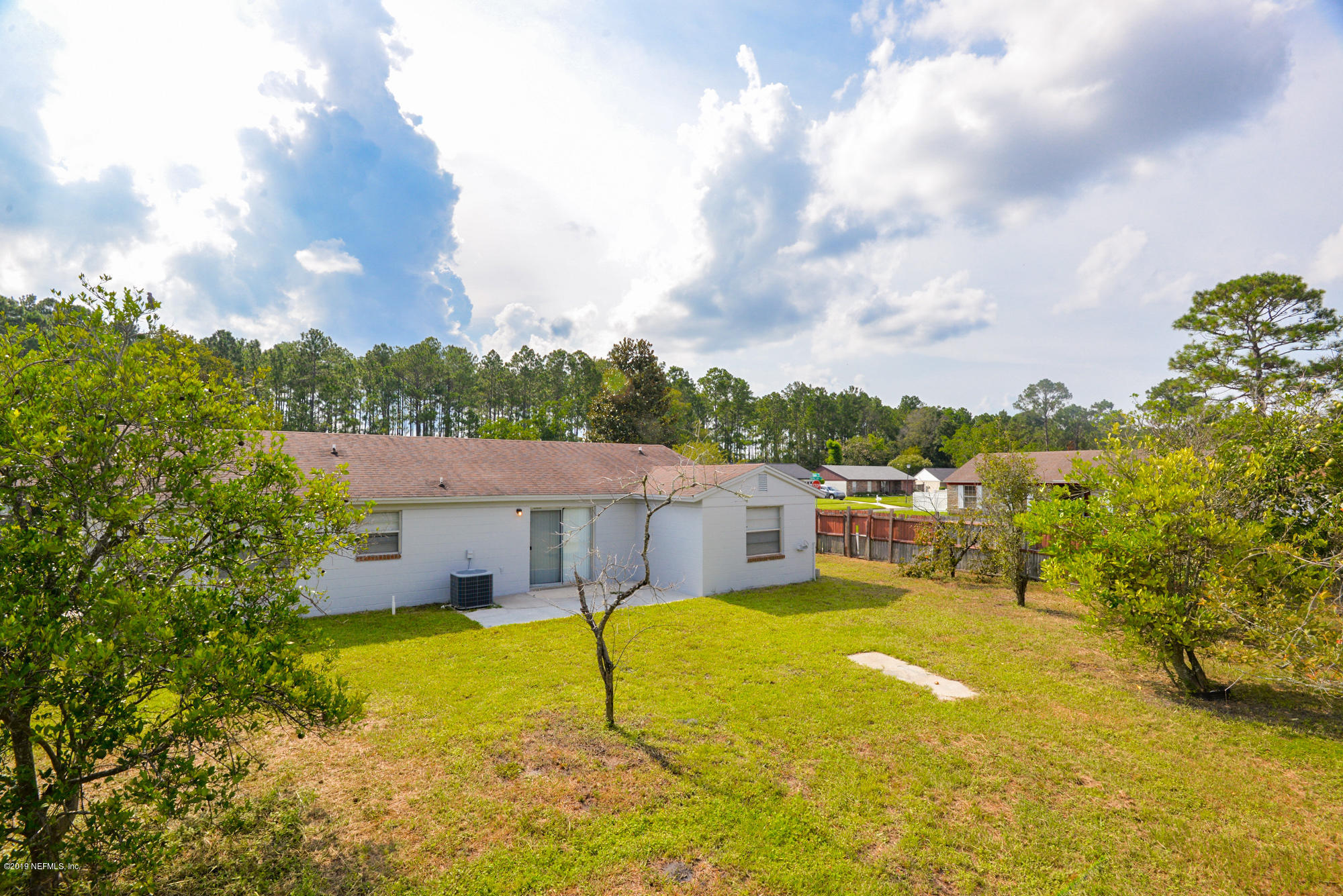 2545 Spring Lake Road West Jacksonville, FL 32210 - Photo 20 of 21 a view of a swimming pool with a patio