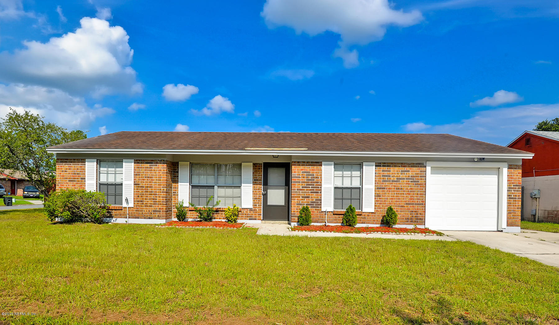 2545 Spring Lake Road West Jacksonville, FL 32210 - Photo 2 of 21 a front view of house with yard and outdoor seating