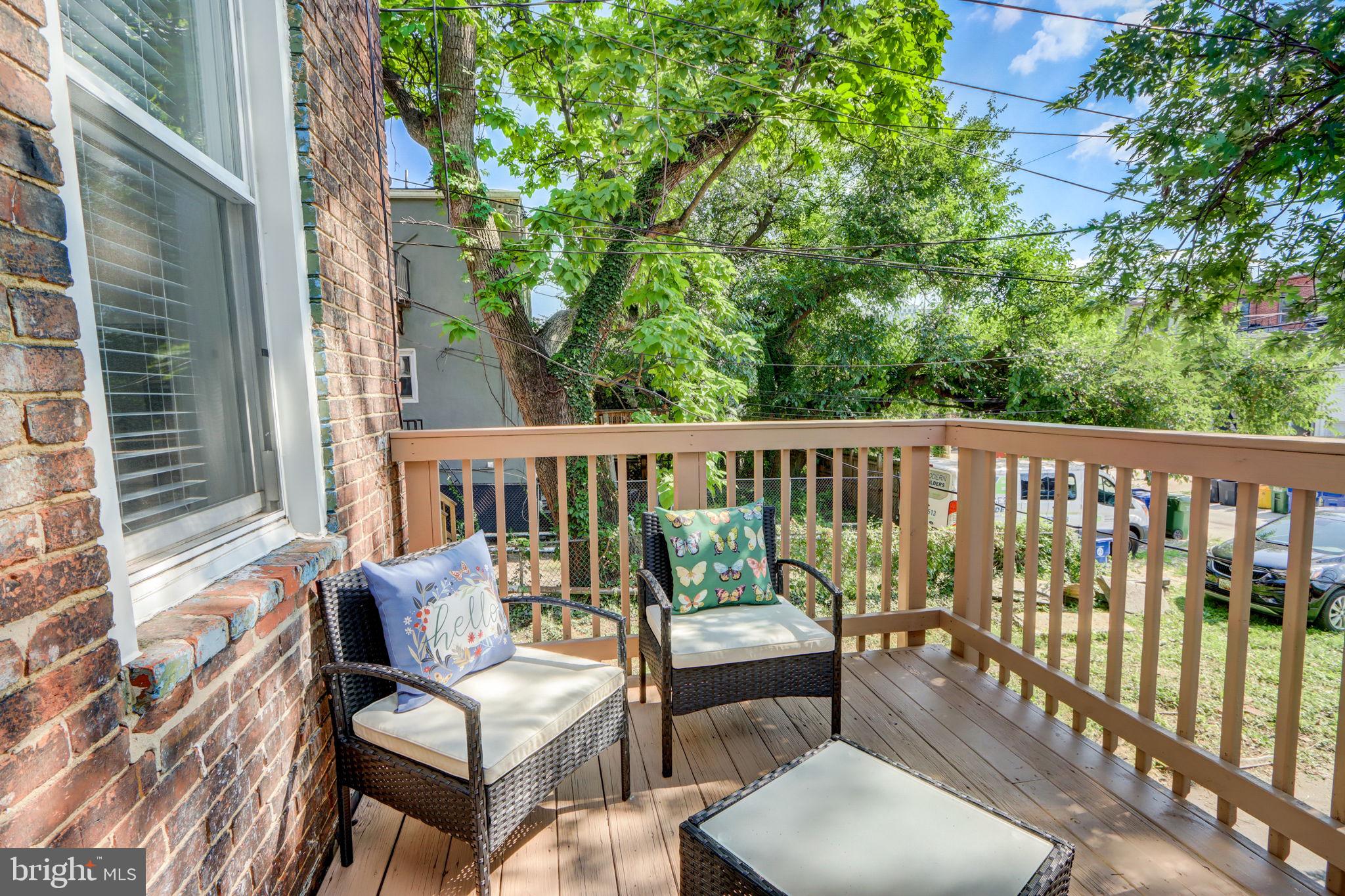 1628 North Calvert Street Baltimore, MD 21202 - Photo 23 of 63 a view of a chair and tables in the balcony