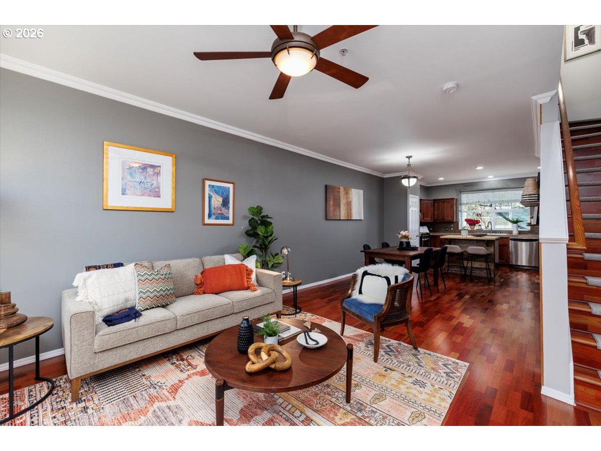 723 Southeast Fairwinds Loop, Unit BLDG H Vancouver, WA 98661 - Photo 2 of 34 a living room with furniture and wooden floor