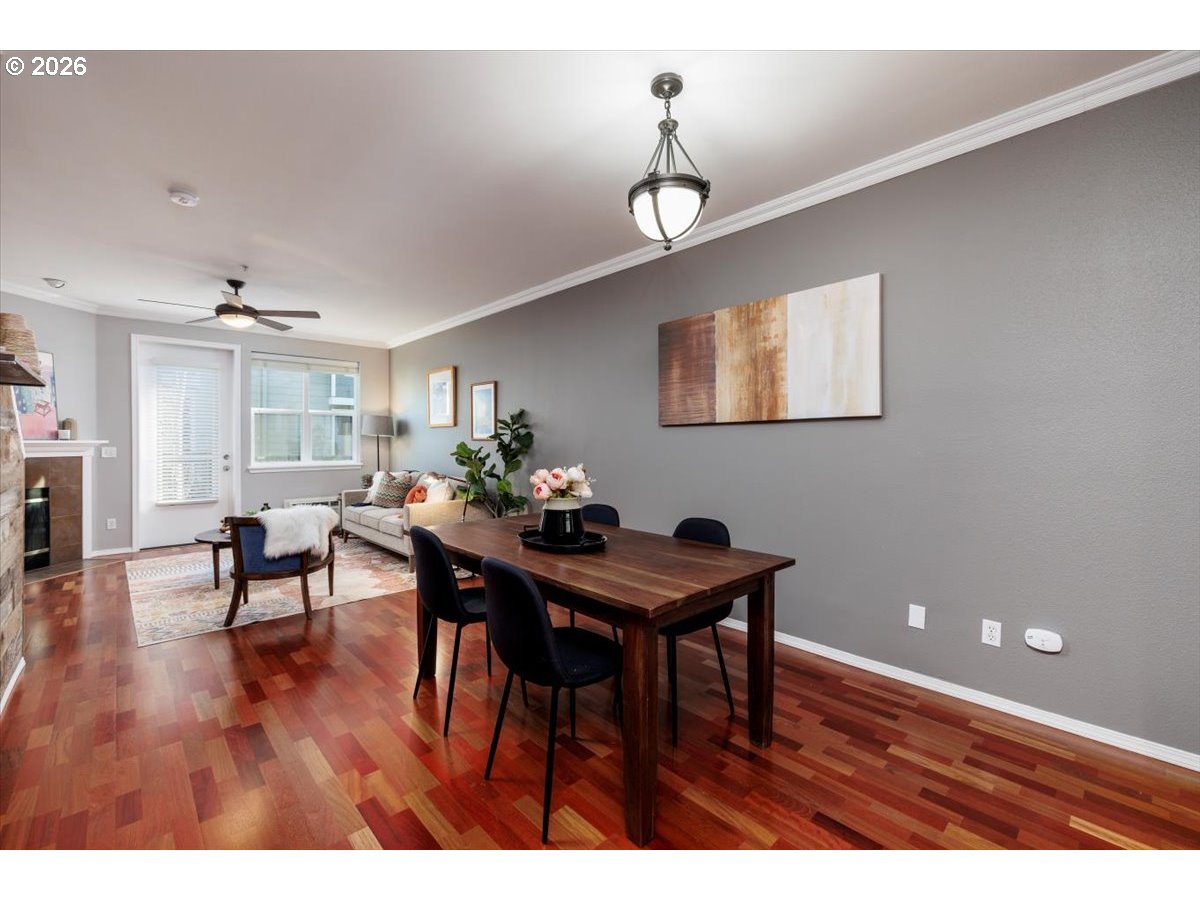 723 Southeast Fairwinds Loop, Unit BLDG H Vancouver, WA 98661 - Photo 10 of 34 a view of a dining room with furniture and wooden floor