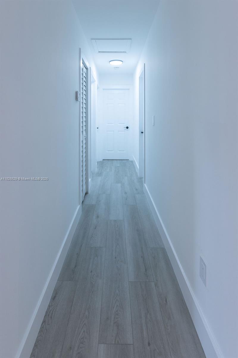 355 Southwest 17th Avenue Homestead, FL 33030 - Photo 9 of 21 a view of a hallway with wooden floor