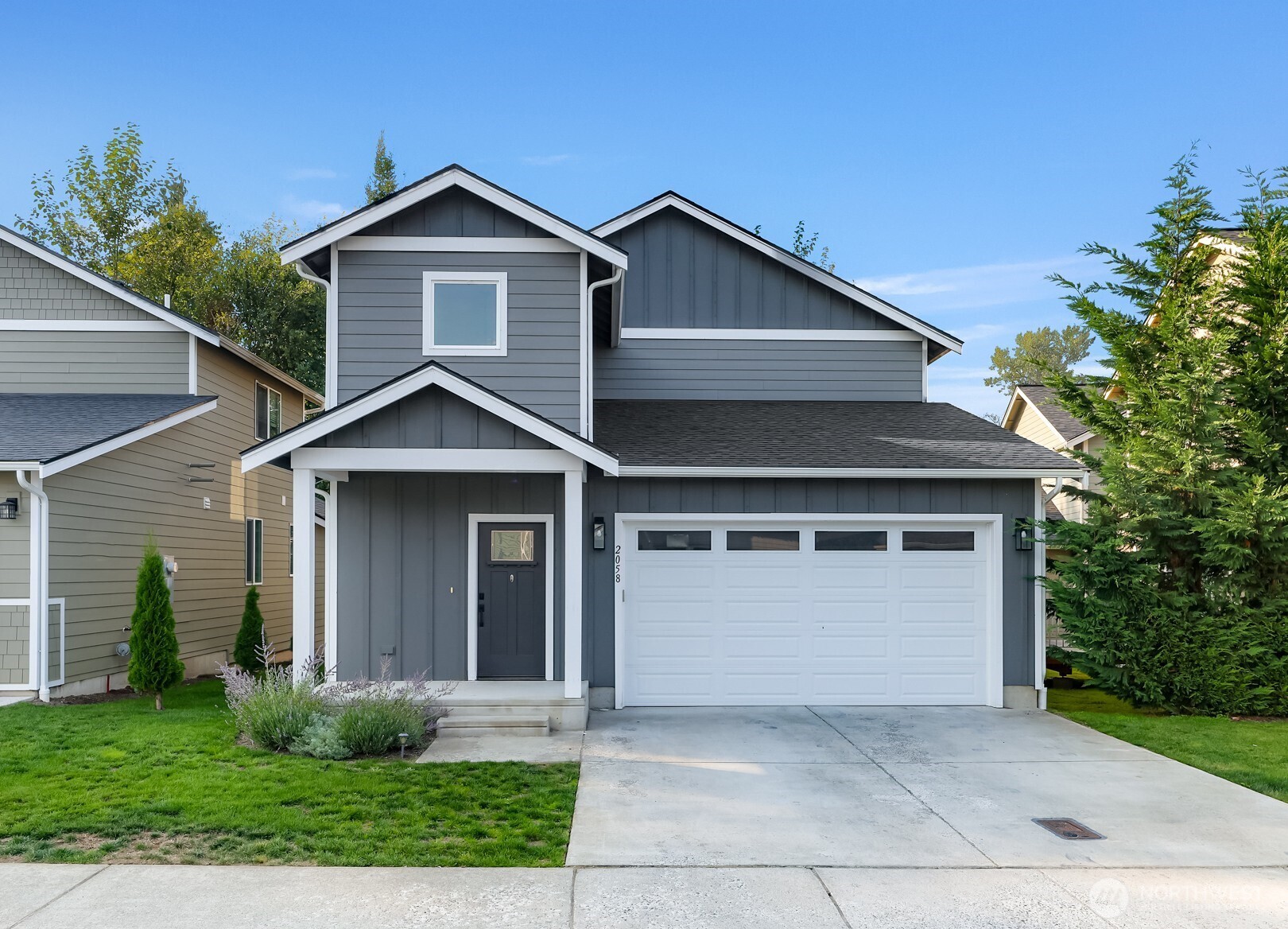 2058 Andre Court Ferndale, WA 98248 - Photo 1 of 39 a front view of a house with a yard and garage