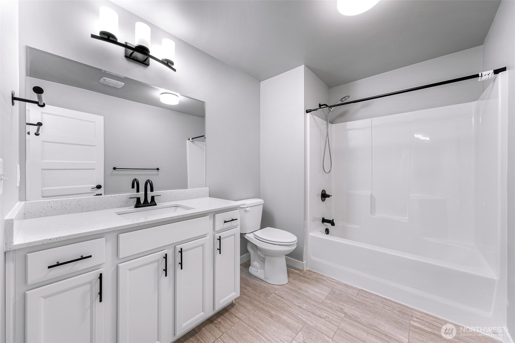 2058 Andre Court Ferndale, WA 98248 - Photo 12 of 39 a bathroom with a double vanity sink toilet mirror and bathtub