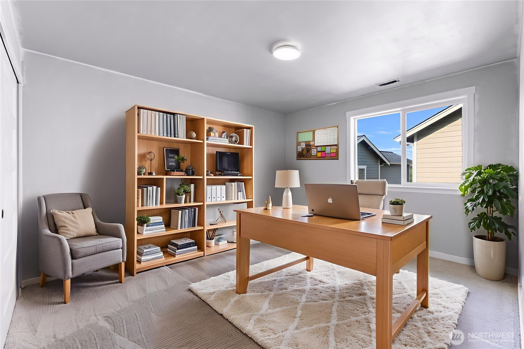 2058 Andre Court Ferndale, WA 98248 - Photo 13 of 39 a view of a workspace with furniture and bookshelf