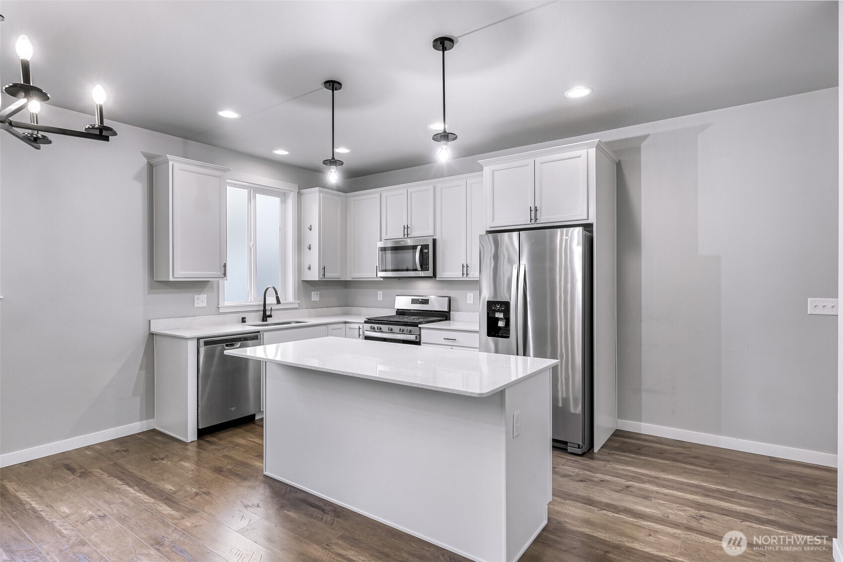 2058 Andre Court Ferndale, WA 98248 - Photo 16 of 39 a kitchen with kitchen island a sink stainless steel appliances and cabinets