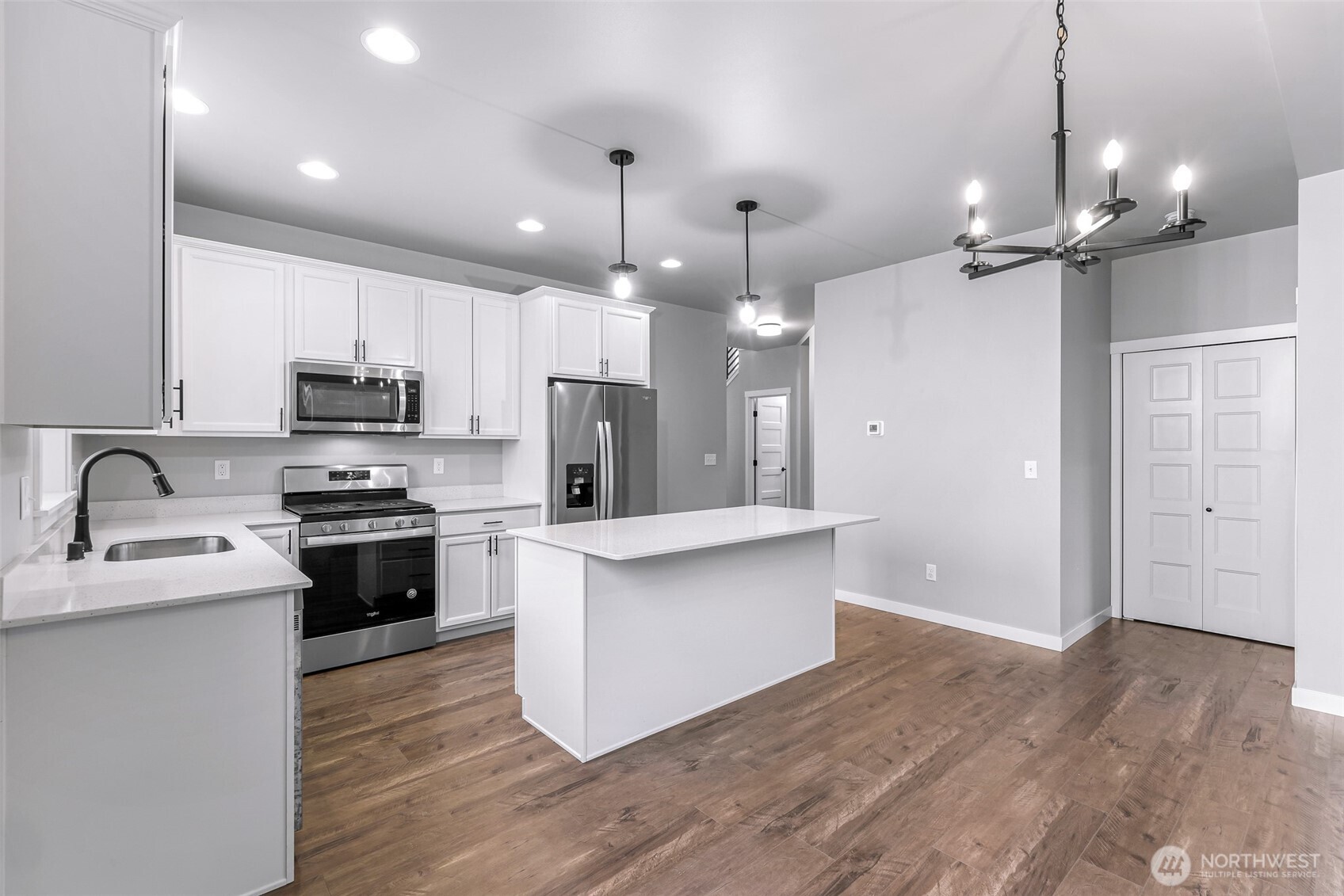 2058 Andre Court Ferndale, WA 98248 - Photo 19 of 39 a kitchen with kitchen island a sink stainless steel appliances and cabinets