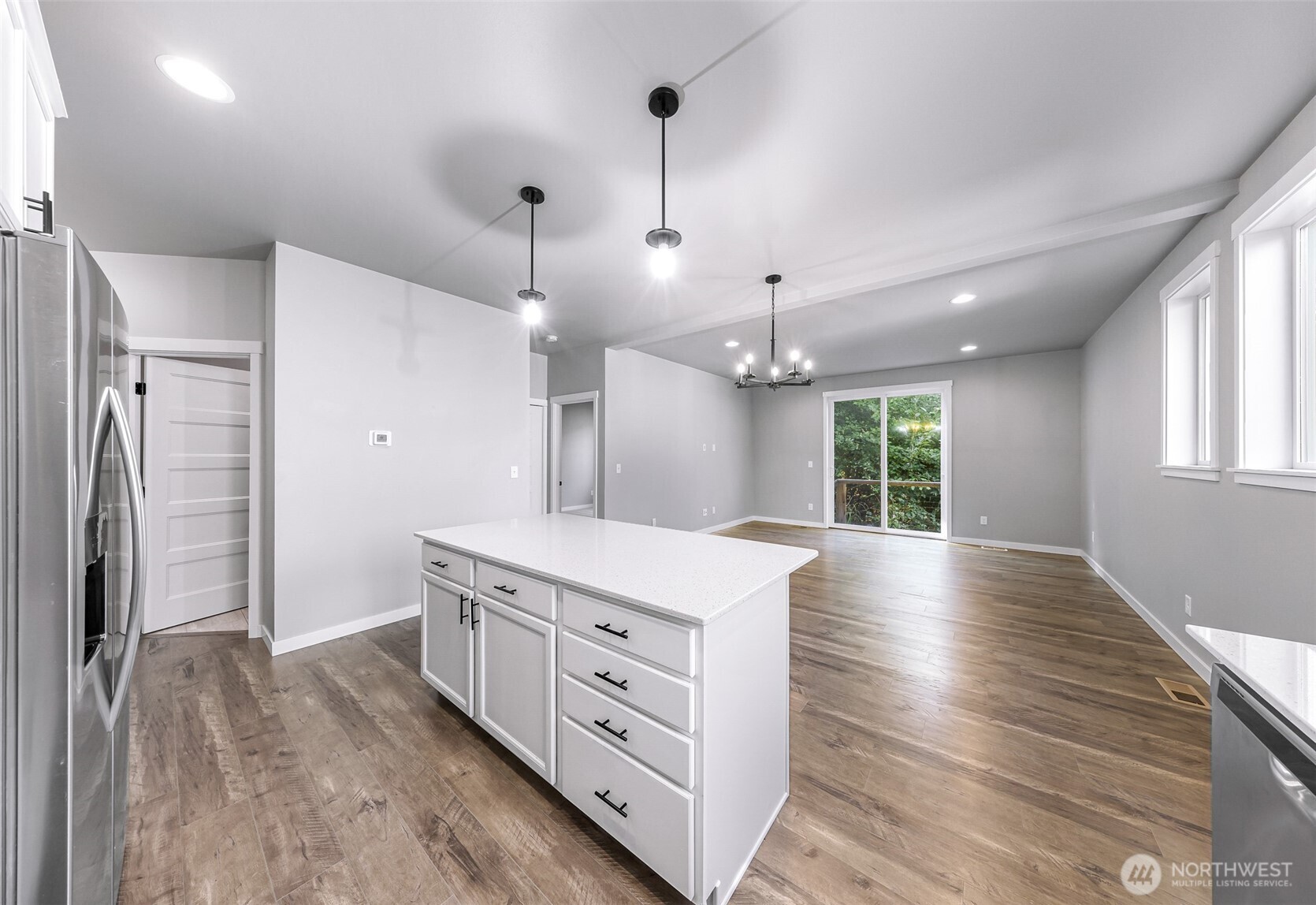 2058 Andre Court Ferndale, WA 98248 - Photo 20 of 39 a kitchen with stainless steel appliances kitchen island hardwood floor and a window