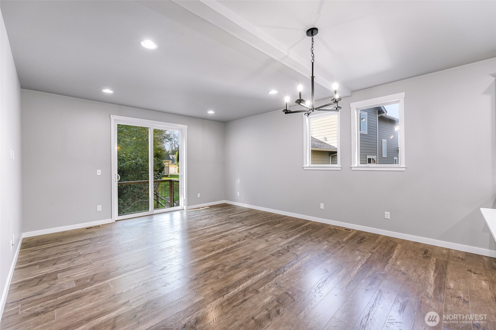 2058 Andre Court Ferndale, WA 98248 - Photo 22 of 39 a view of an empty room with wooden floor and a window