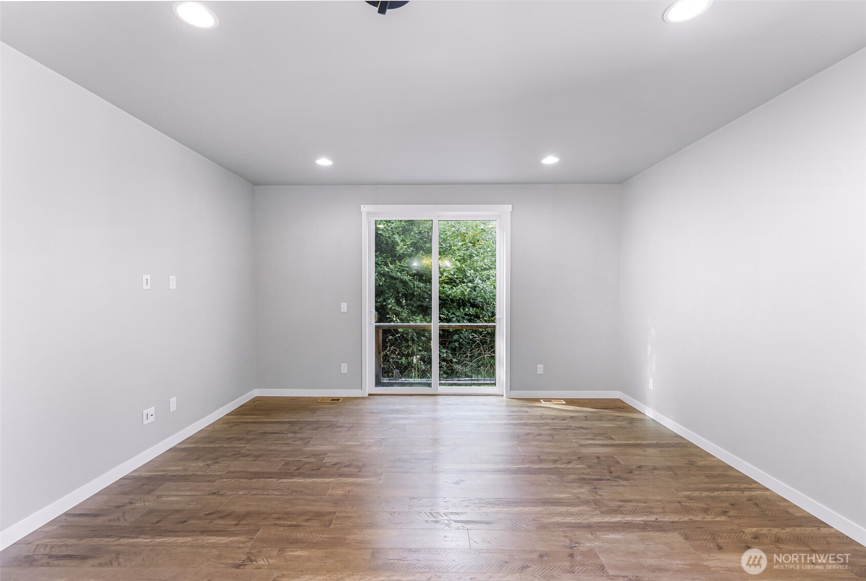 2058 Andre Court Ferndale, WA 98248 - Photo 27 of 39 a view of an empty room with wooden floor and a window
