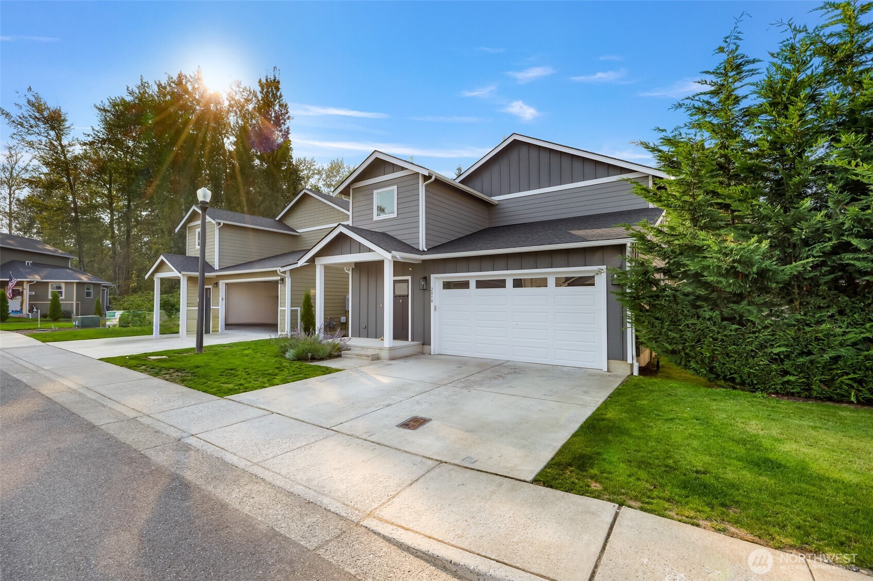 2058 Andre Court Ferndale, WA 98248 - Photo 3 of 39 a front view of a house with a yard and garage