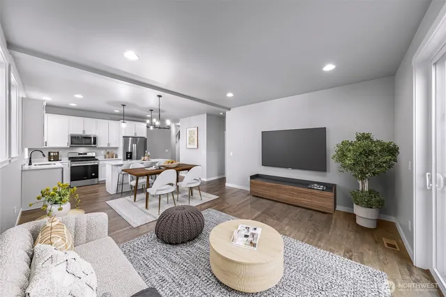 a living room with furniture and a potted plant