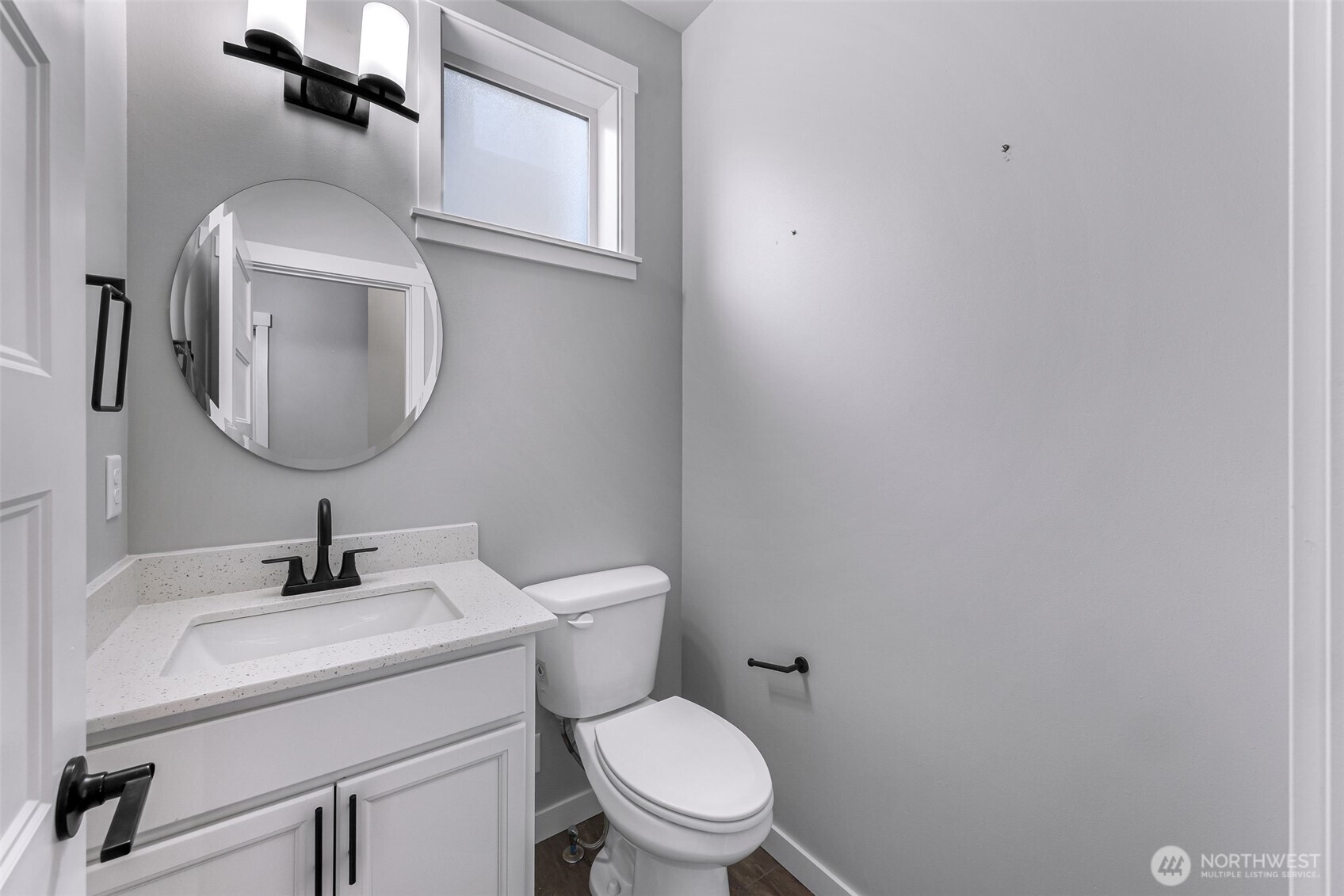 2058 Andre Court Ferndale, WA 98248 - Photo 7 of 39 a bathroom with a toilet sink and mirror