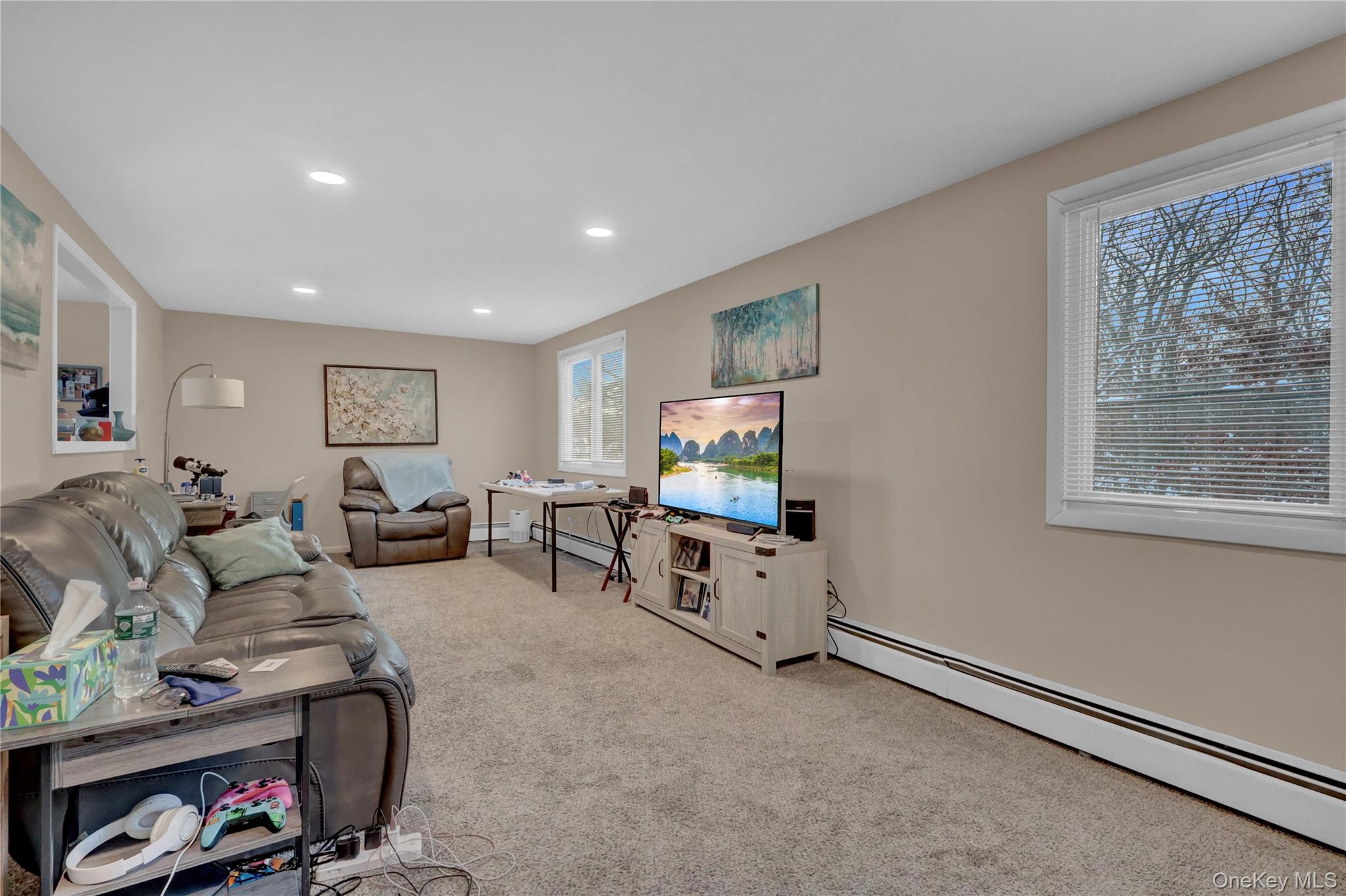 199 August Road North Babylon, NY 11703 - Photo 18 of 32 2nd floor Carpeted living area featuring baseboard heating and recessed lighting