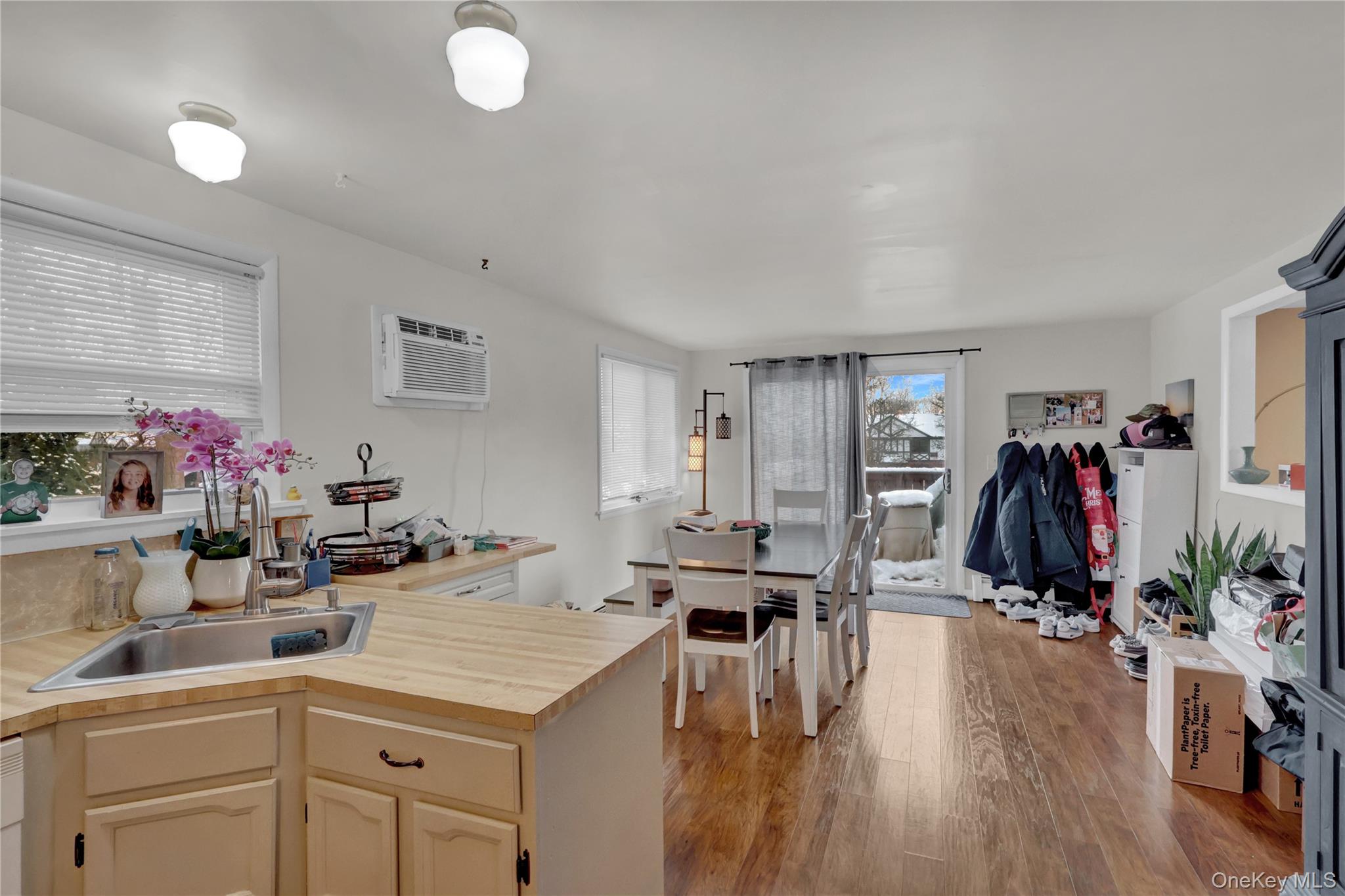 199 August Road North Babylon, NY 11703 - Photo 20 of 32 2nd floor Kitchen with light wood-style flooring and a wall mounted AC