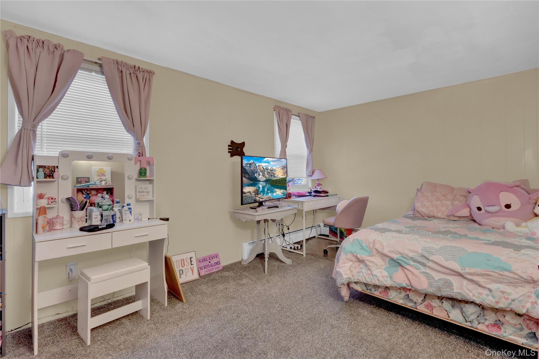 199 August Road North Babylon, NY 11703 - Photo 26 of 32 2nd floor Bedroom featuring light carpet and baseboard heating