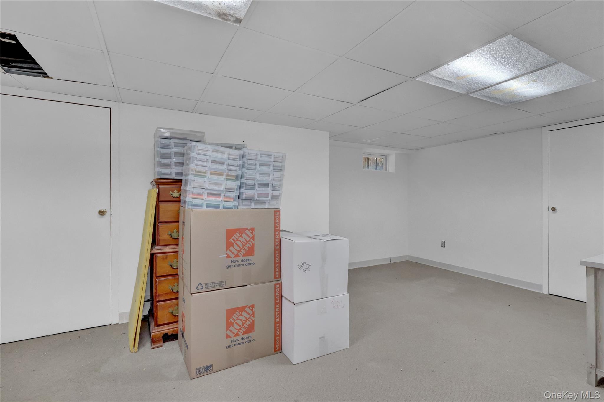 199 August Road North Babylon, NY 11703 - Photo 27 of 32 Finished below grade area featuring a paneled ceiling