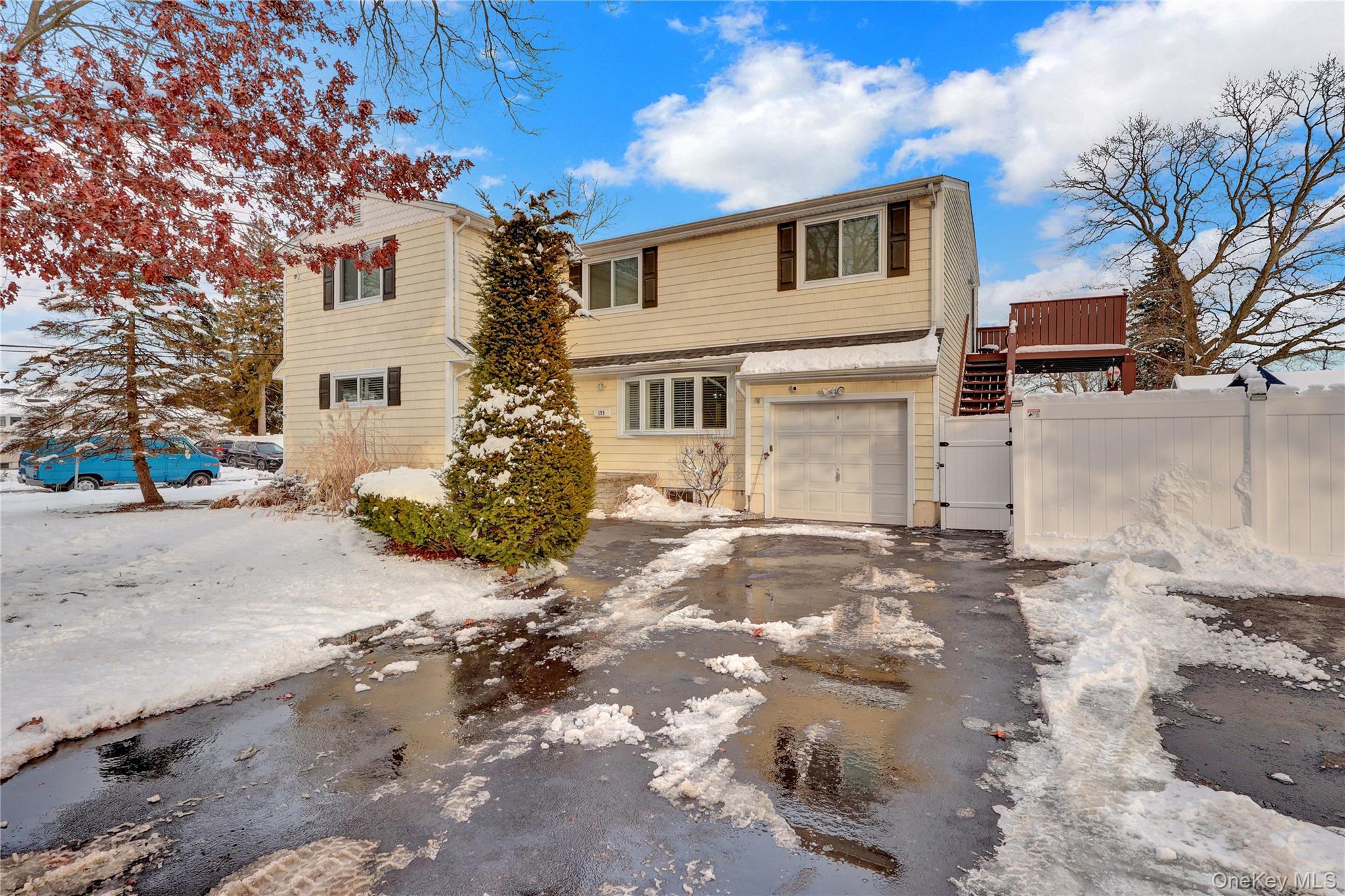 199 August Road North Babylon, NY 11703 - Photo 3 of 32 Traditional-style house featuring a garage and asphalt driveway