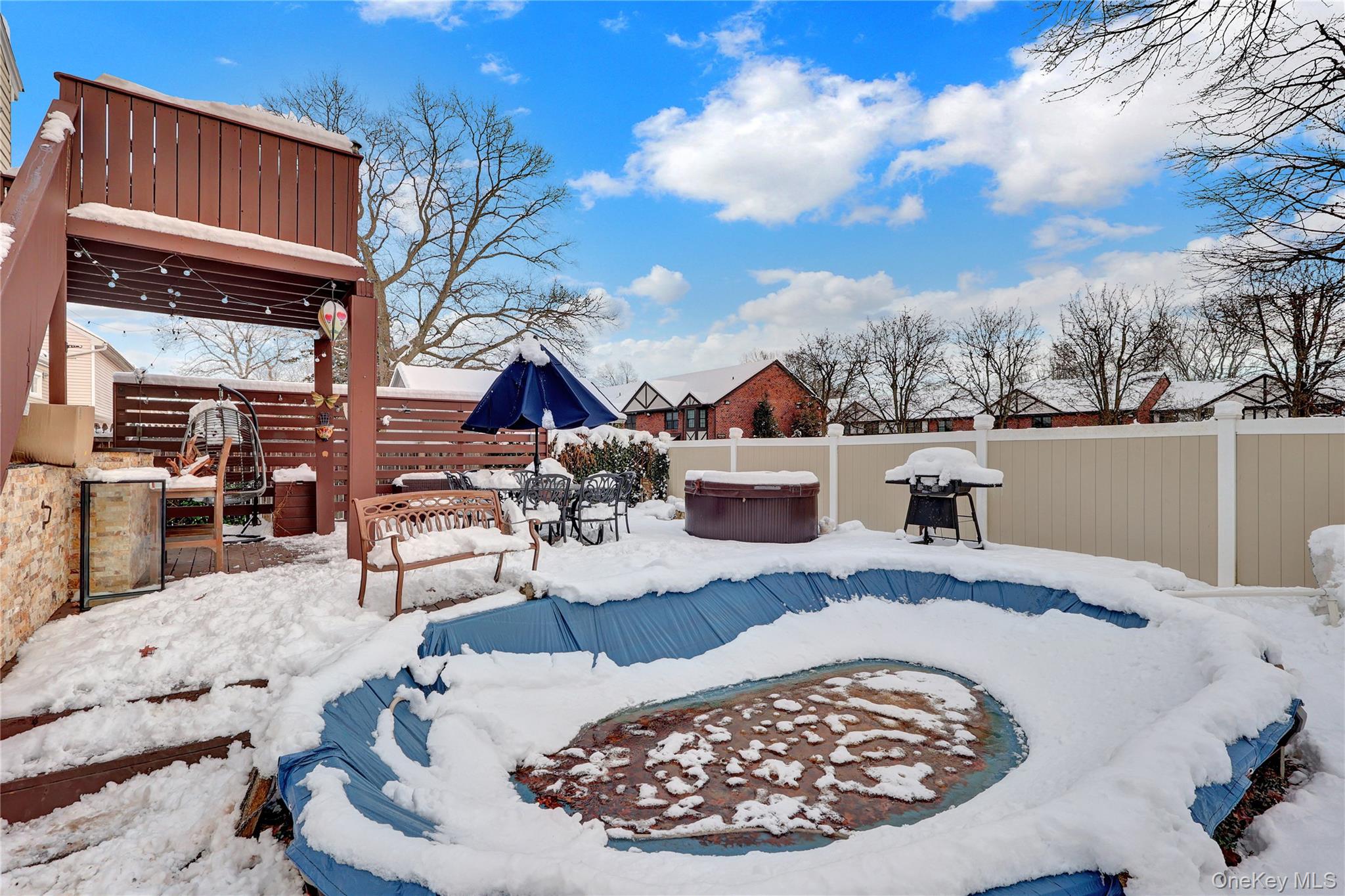 199 August Road North Babylon, NY 11703 - Photo 31 of 32 Yard with a pool, & hot tub, a fenced backyard, and a wooden deck