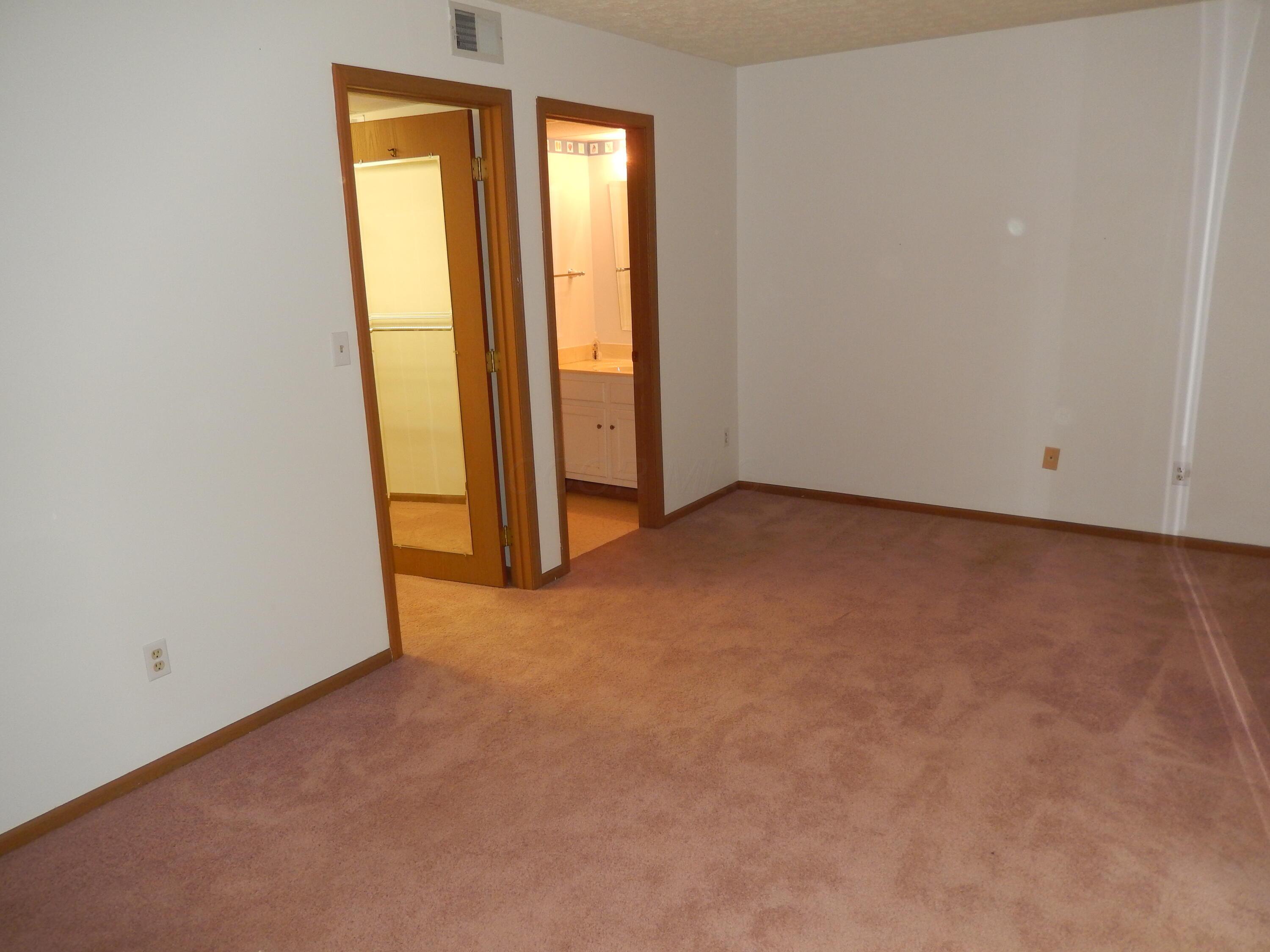 3939 Karl Road, Unit 122 Columbus, OH 43224 - Photo 32 of 57 Primary Bedroom with walk-in closet and full bath with shower
