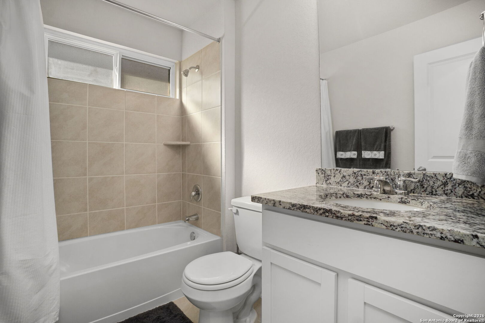 3658 Copper Willow Bulverde, TX 78163 - Photo 16 of 27 a bathroom with a granite countertop sink toilet and shower