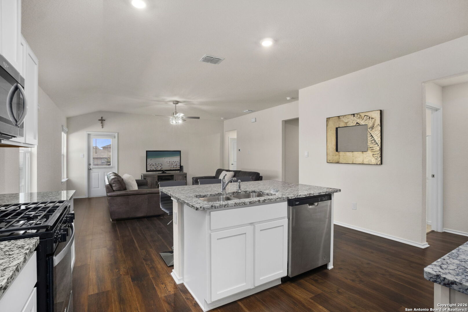 3658 Copper Willow Bulverde, TX 78163 - Photo 7 of 27 a kitchen with a counter top space a stove wooden floor and windows
