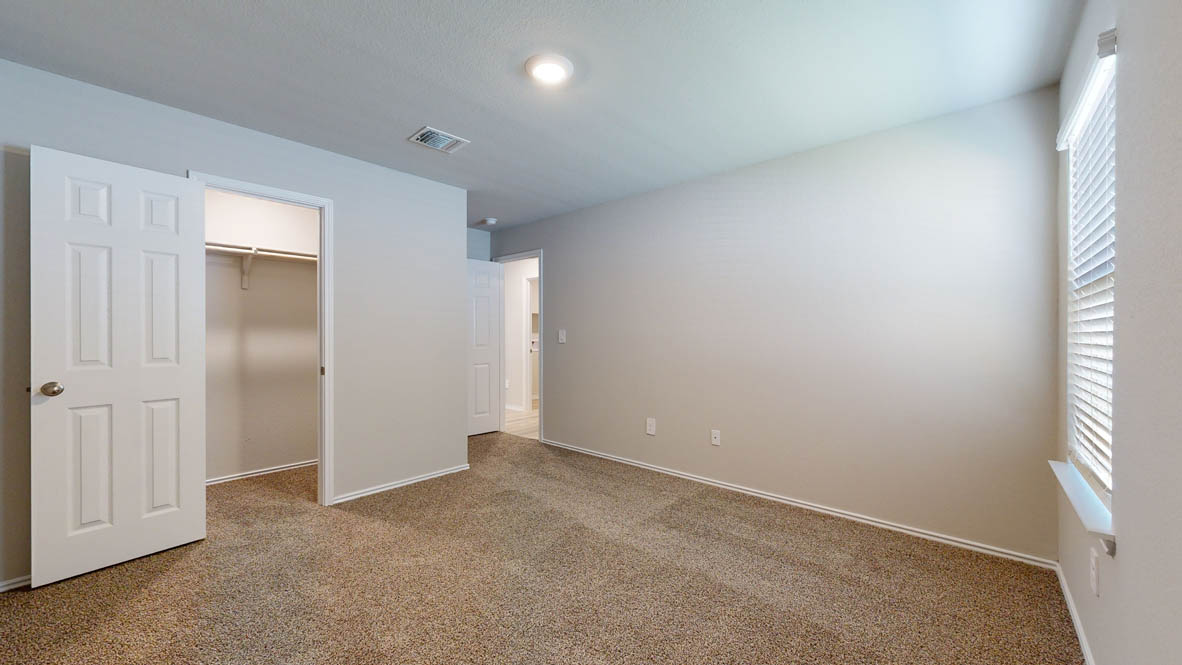 175 Rearden Boulevard Jarrell, TX 76537 - Photo 23 of 29 an empty room with windows and closet