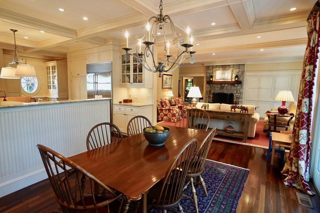 166 Atlantic Avenue Marblehead, MA 01945 - Photo 11 of 36 a view of a dining room with furniture and wooden floor