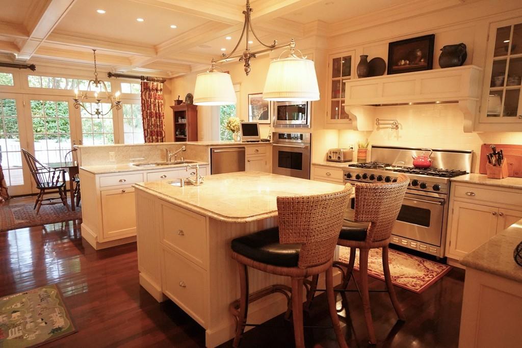166 Atlantic Avenue Marblehead, MA 01945 - Photo 12 of 36 a kitchen with stainless steel appliances granite countertop a table chairs stove a sink and dishwasher a refrigerator with wooden floor