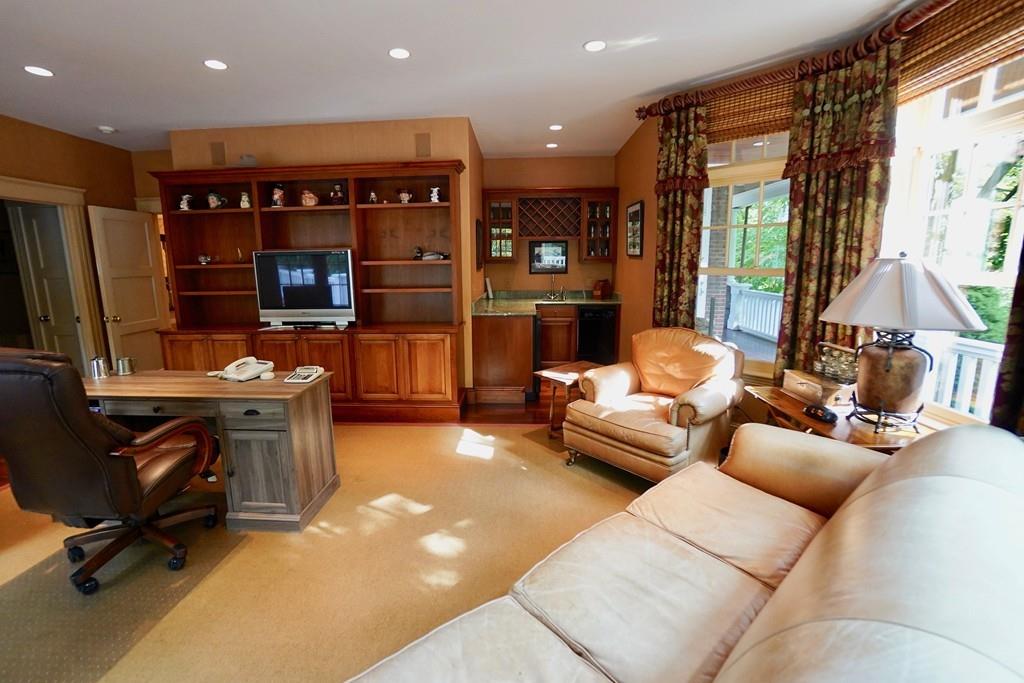 166 Atlantic Avenue Marblehead, MA 01945 - Photo 18 of 36 a living room with furniture and a flat screen tv