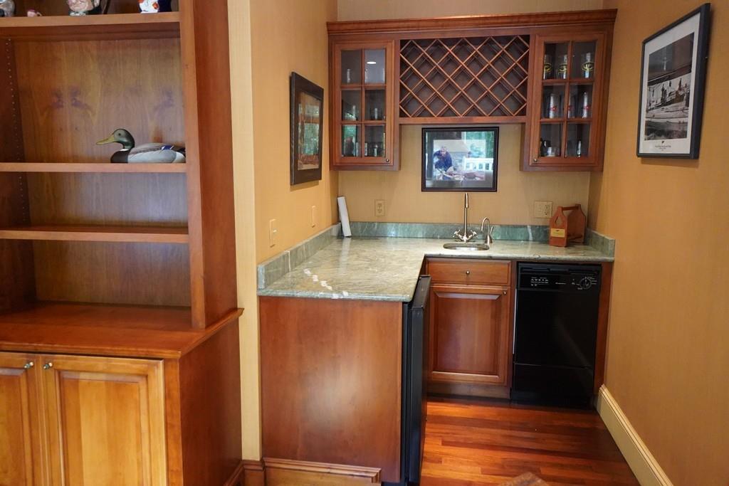 166 Atlantic Avenue Marblehead, MA 01945 - Photo 19 of 36 a kitchen with a sink and a refrigerator