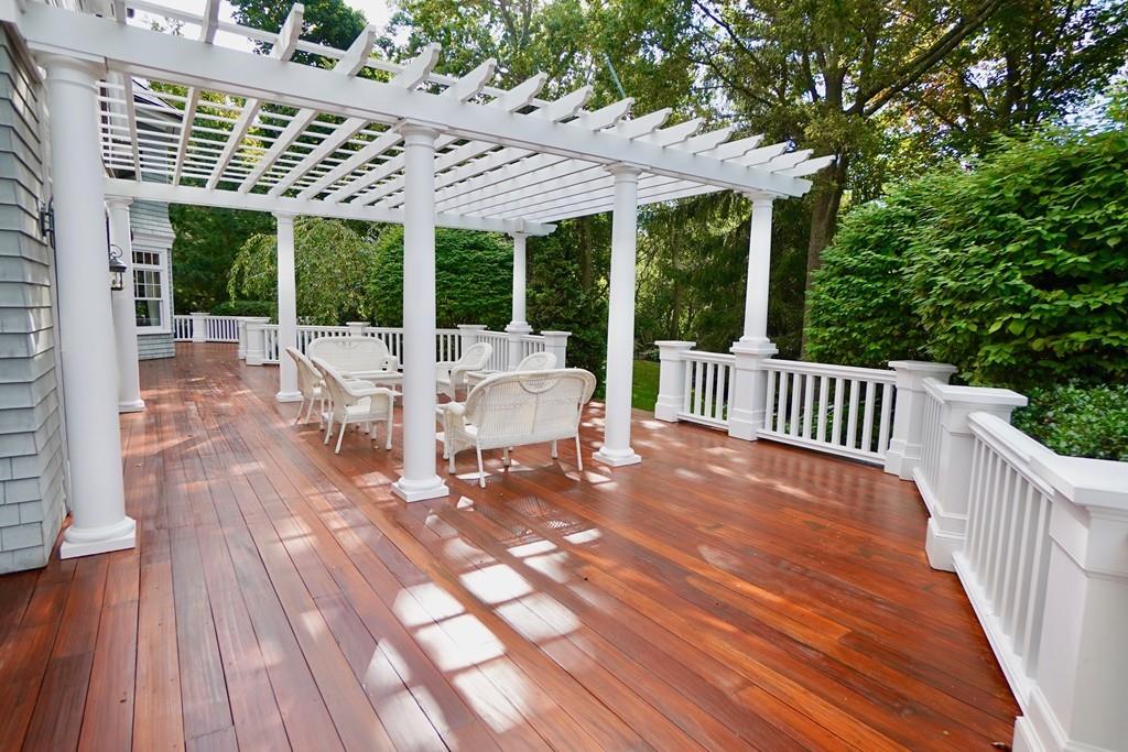 166 Atlantic Avenue Marblehead, MA 01945 - Photo 20 of 36 a view of a patio with a table chairs and wooden floor