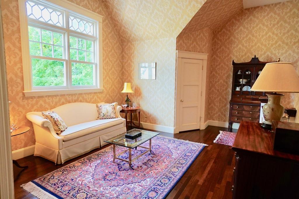 166 Atlantic Avenue Marblehead, MA 01945 - Photo 21 of 36 a living room with furniture and a rug