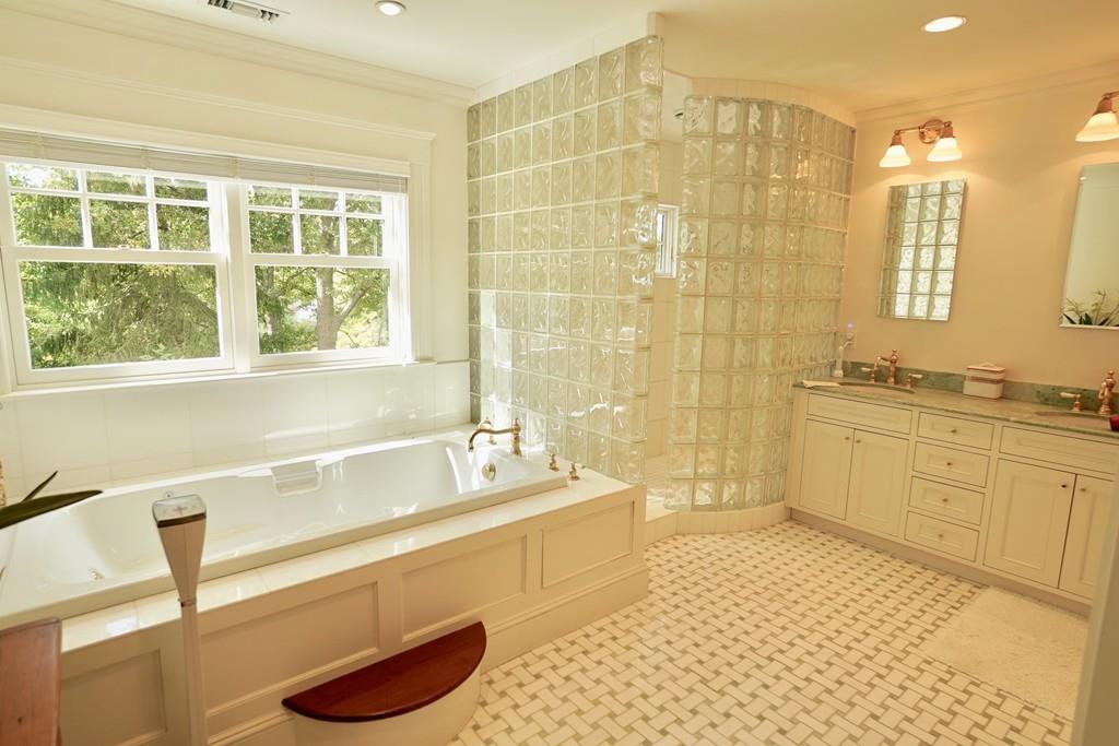 166 Atlantic Avenue Marblehead, MA 01945 - Photo 24 of 36 a bathroom with a tub sink and a shower