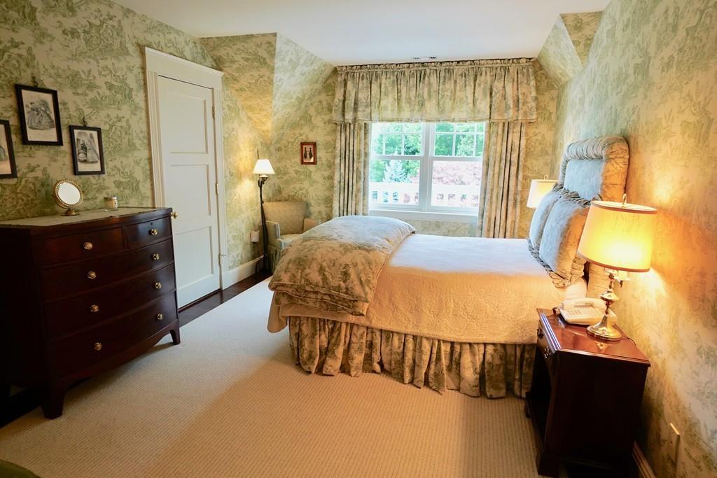 166 Atlantic Avenue Marblehead, MA 01945 - Photo 26 of 36 a bedroom with a bed and a window