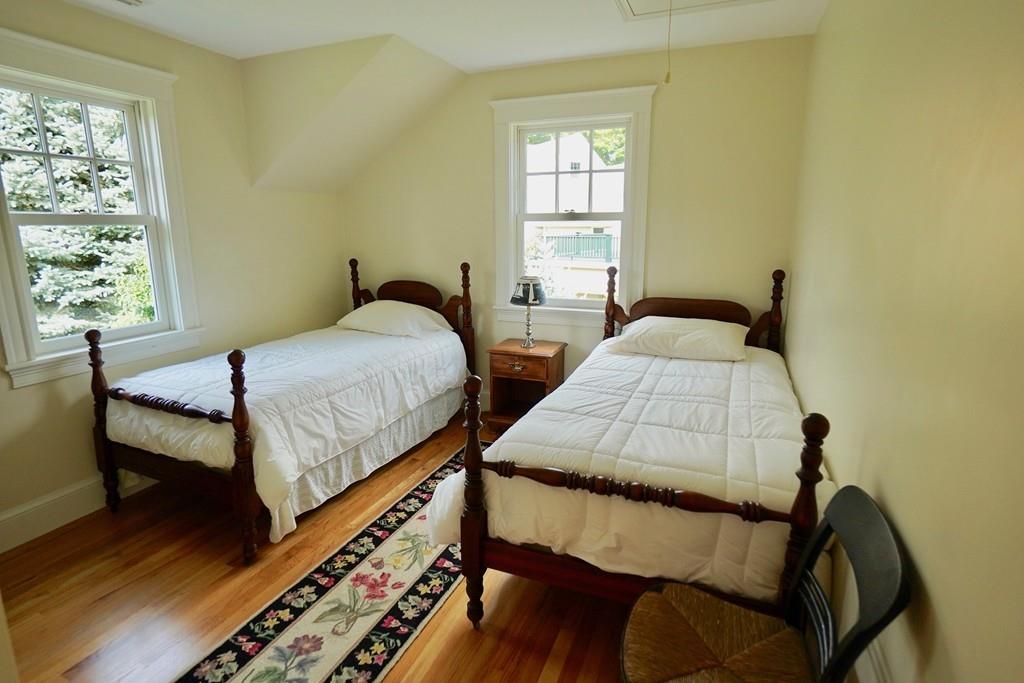 166 Atlantic Avenue Marblehead, MA 01945 - Photo 30 of 36 a bedroom with two beds and wooden floor