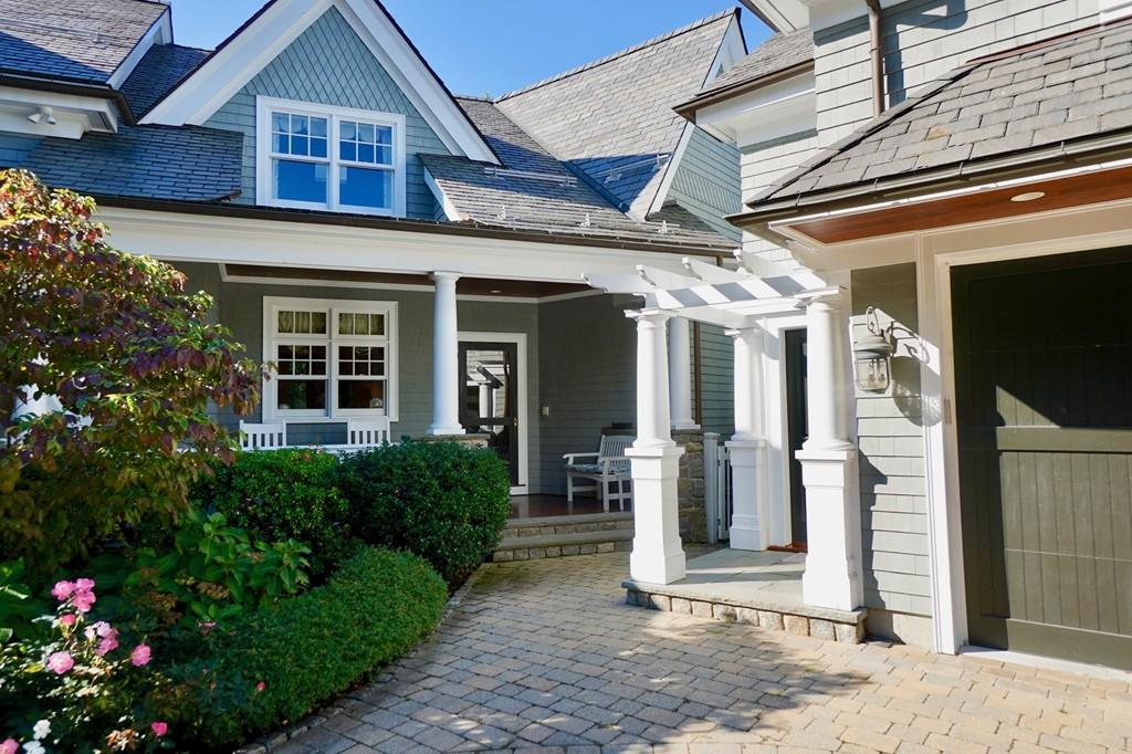 166 Atlantic Avenue Marblehead, MA 01945 - Photo 4 of 36 a front view of a house with a porch