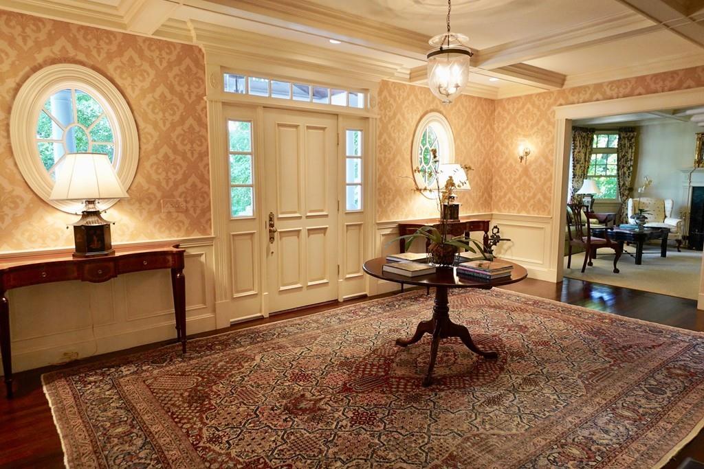 166 Atlantic Avenue Marblehead, MA 01945 - Photo 5 of 36 a living room with a large window and a chandelier