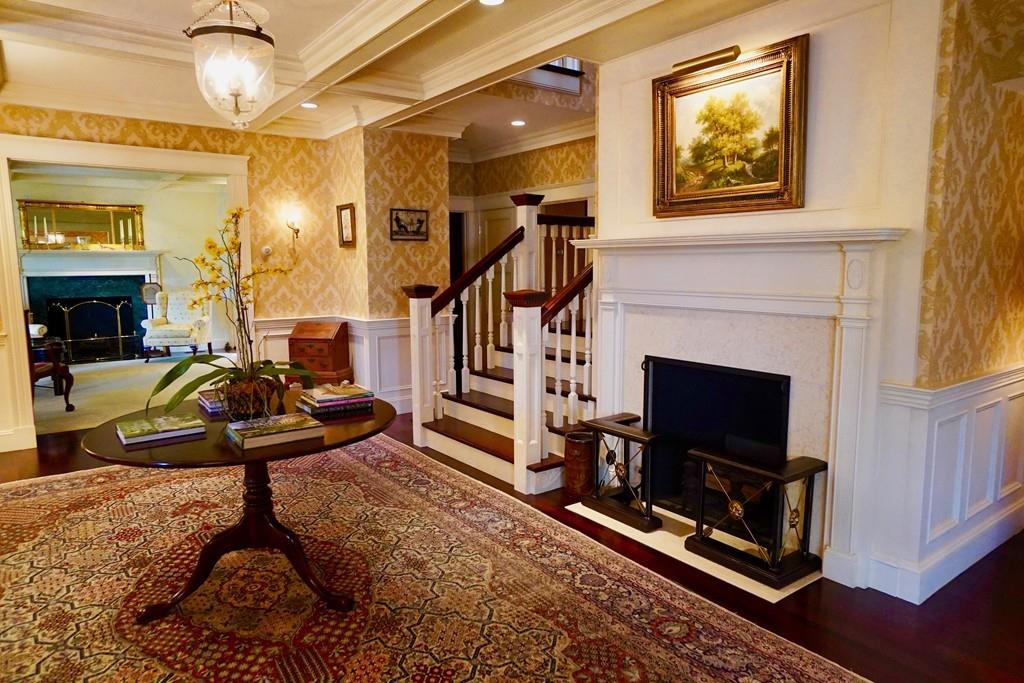 166 Atlantic Avenue Marblehead, MA 01945 - Photo 7 of 36 a living room with furniture a flat screen tv and a fireplace