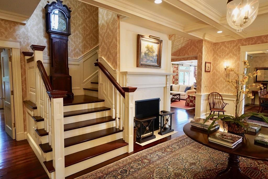 166 Atlantic Avenue Marblehead, MA 01945 - Photo 8 of 36 a view of a livingroom with furniture and a fireplace