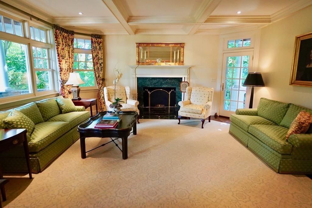 166 Atlantic Avenue Marblehead, MA 01945 - Photo 9 of 36 a living room with furniture and a fireplace