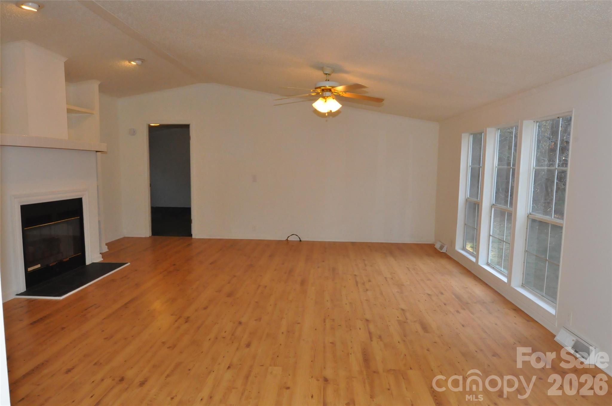 1413 Minter Road Chester, SC 29706 - Photo 2 of 20 a view of an empty room with a fireplace
