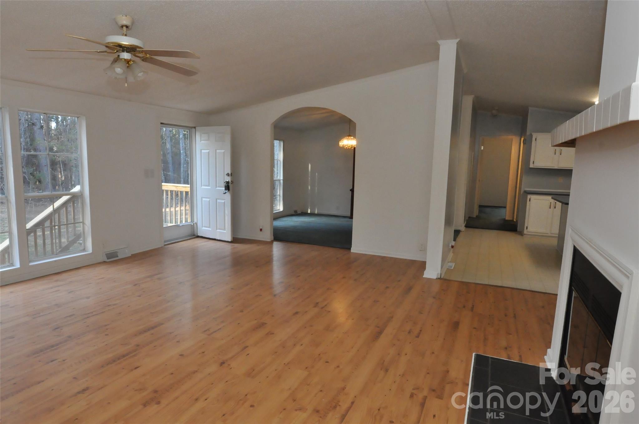 1413 Minter Road Chester, SC 29706 - Photo 5 of 20 a view of empty room with a fireplace and wooden floor