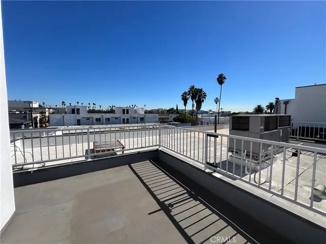 a view of balcony with two chairs and a table