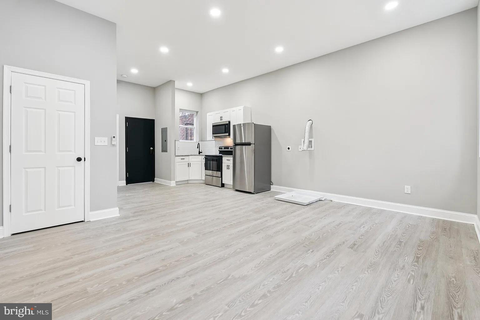 916 North Arlington Avenue, Unit 3 Baltimore, MD 21217 - Photo 6 of 7 a view of a kitchen with a sink and a refrigerator