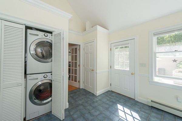 39 R Kimball Road Amesbury, MA 01913 - Photo 16 of 28 a view of a hallway with washer and dryer