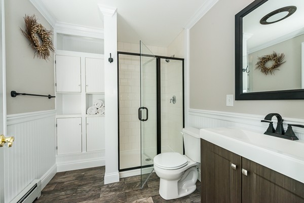 39 R Kimball Road Amesbury, MA 01913 - Photo 22 of 28 a bathroom with a sink a toilet and shower